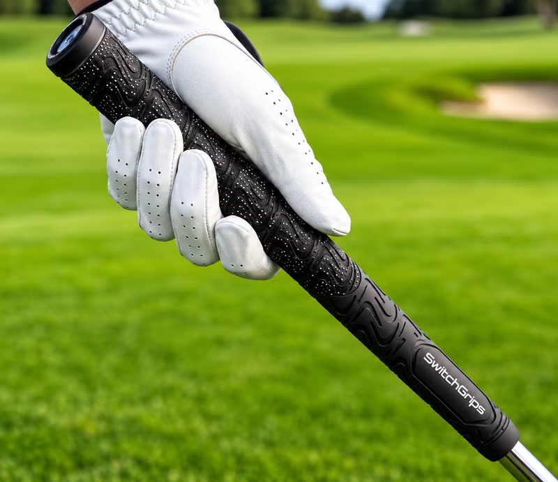 SwitchGrips golf grip held in a gloved hand on a golf course